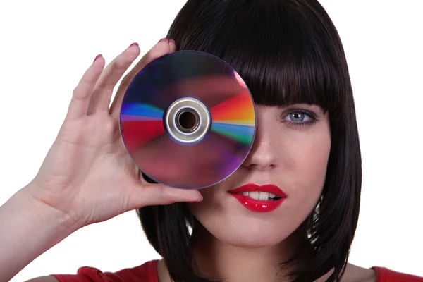 Femme tenant un disque compact — Photo
