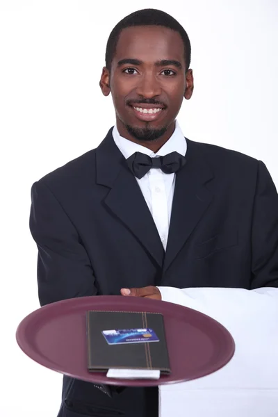 stock image Smart waiter with the bill and a credit card