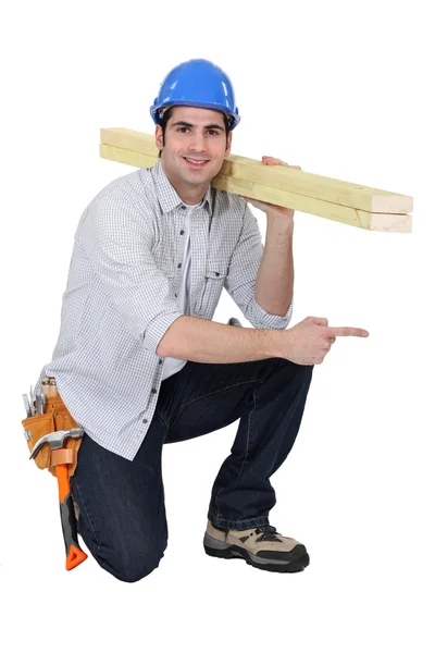 Woodworker pointing at something — Stock Photo, Image