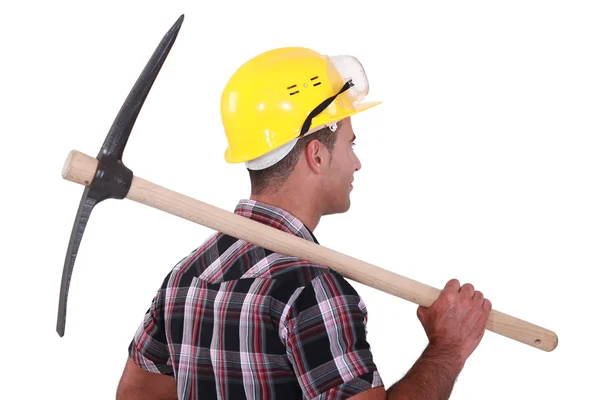 A man with a pickaxe. — Stock Photo, Image
