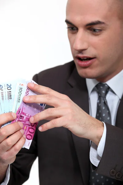 Businessman counting cash — Stock Photo, Image