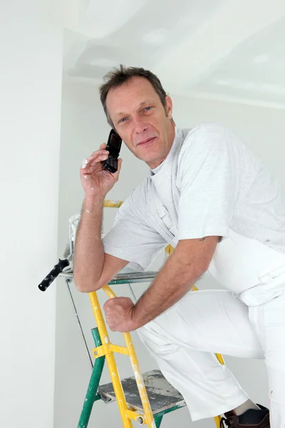 Painter taking a call — Stock Photo, Image