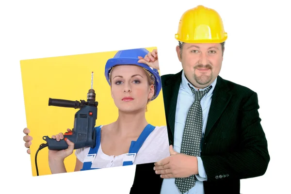 Contractor holding picture of woman building worker — Stock Photo, Image