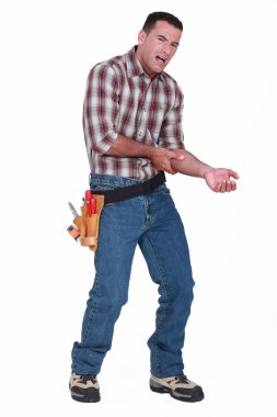 Builder with pain in arm clipart