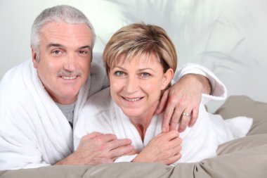 Mature couple in bed clipart