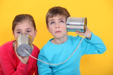 Children with a tin can phone clipart