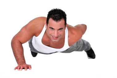 Young man doing push-ups clipart