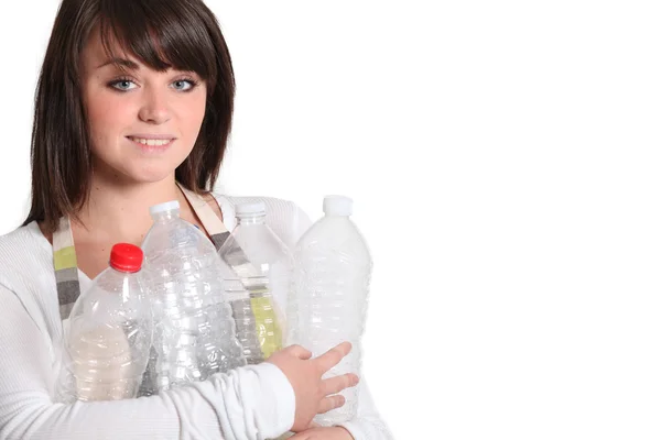 Young woman taking out the recycling — Stock Photo, Image