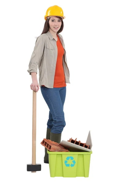 Female construction worker recycling old material — Stock Photo, Image