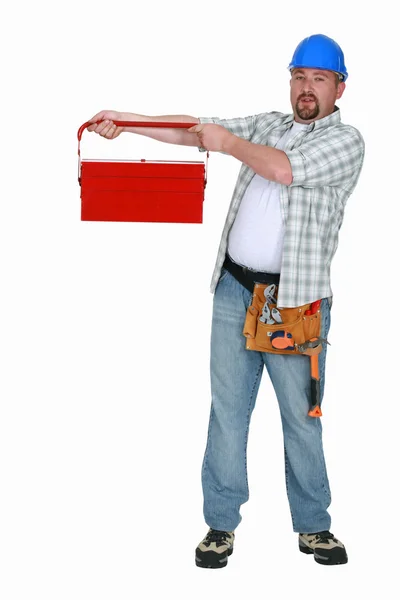 Chunny worker lifting tool-box — Stock Photo, Image