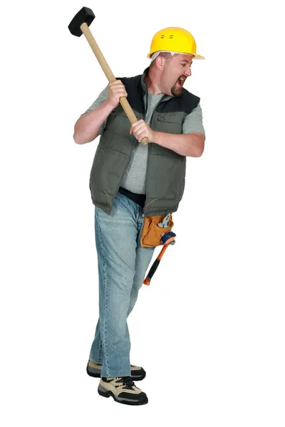 Man with hammer hitting — Stock Photo, Image