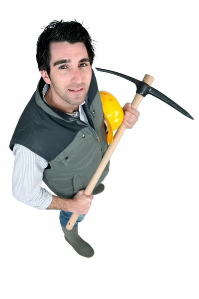 Bricklayer holding pickaxe — Stock Photo, Image