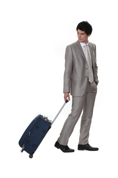 Um homem de negócios saindo em uma viagem de negócios — Fotografia de Stock