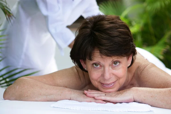 Mature woman having a massage — Stock Photo, Image