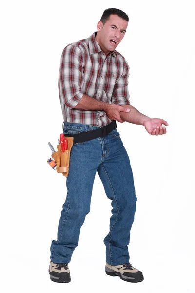 Builder with pain in arm — Stock Photo, Image