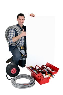 Electrician with white sign clipart