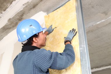 Man fitting wall insulation clipart