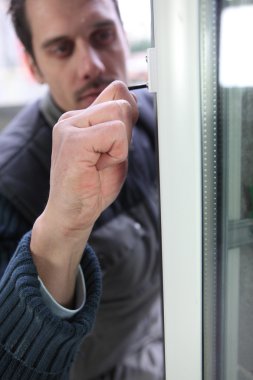 Man fitting a new window clipart