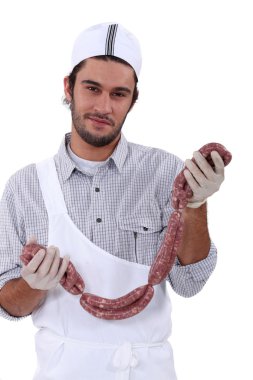 Butcher holding lots of sausages, clipart