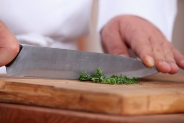 Chef chopping herbs clipart