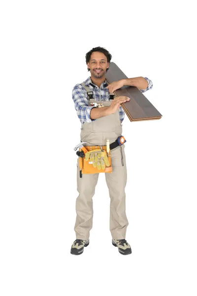 Labourer carrying plywood — Stock Photo, Image