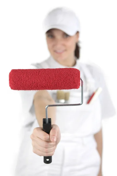Female decorator showing off paint roller — Stock Photo, Image
