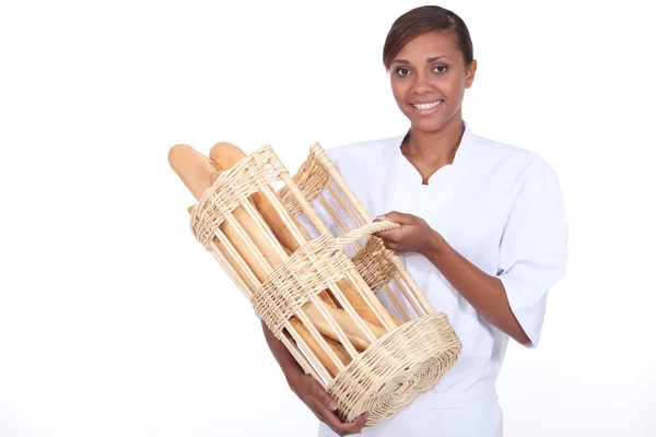 Young baker with basket — Stock Photo, Image
