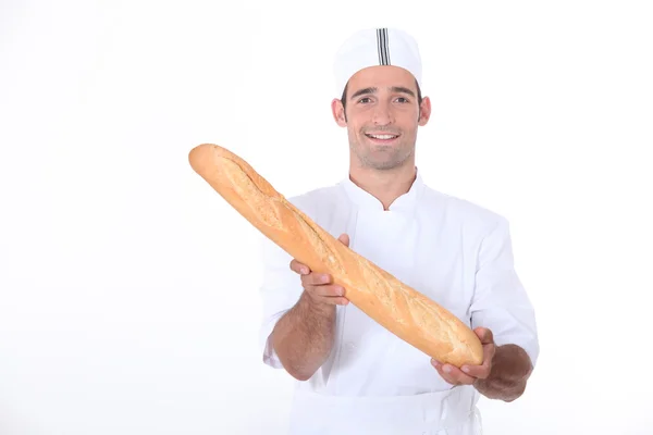 Baker showing off his bread — Stock Photo, Image