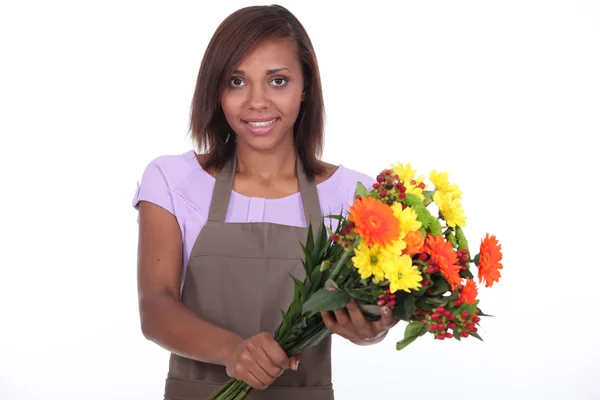 Female florist holding bouquet — Stock Photo, Image