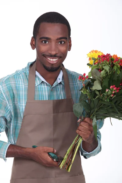 Florist with bouquet of flowers on white background — Stock Photo, Image