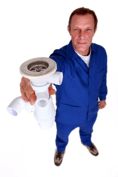 Plumber holding replacement sink plug — Stock Photo, Image