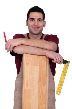 Worker stood with laminate flooring clipart