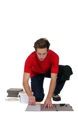 Man posing tiles. clipart