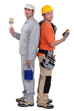 Tradesmen standing back to back clipart