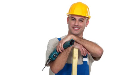 Craftsman with wood and drill clipart