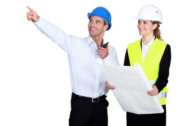 Female architect all smiles accompanied by foreman clipart