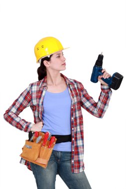 Woman with a cordless drill clipart