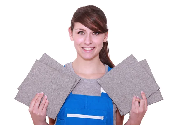 Portrait of a woman holding tiles — Stock Photo, Image