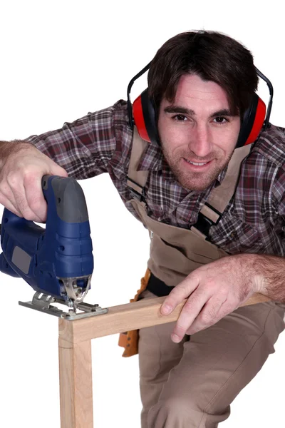 A carpenter using a tool — Stock Photo, Image
