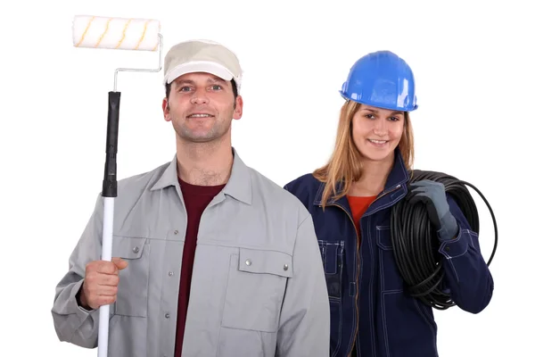 Painter with roller and female electrician — Stock Photo, Image