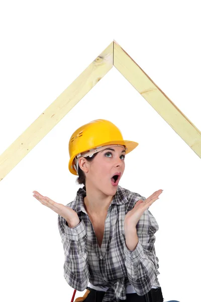 Woman amazed by wooden frame — Stock Photo, Image