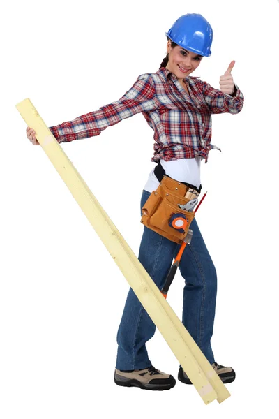 A female carpenter giving the thumb up. — Stock Photo, Image