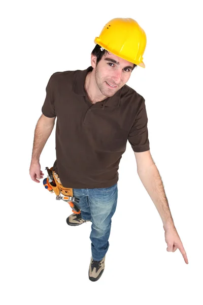 Construction worker pointing to the floor — Stock Photo, Image