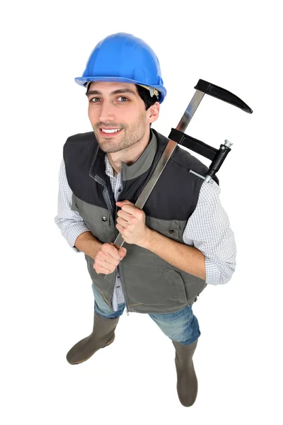 Construtor com uma braçadeira — Fotografia de Stock