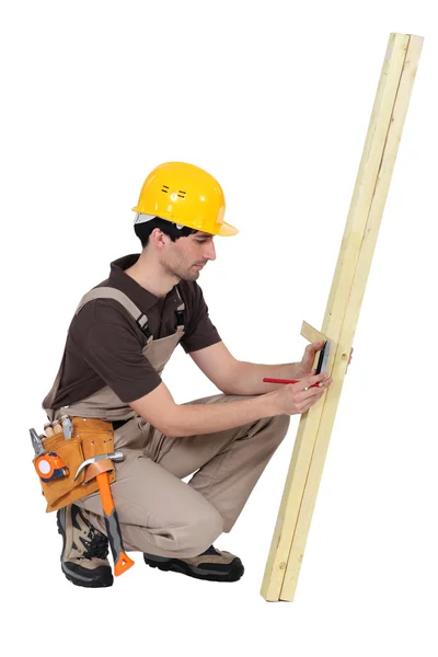 Woodworker taking measurements — Stock Photo, Image