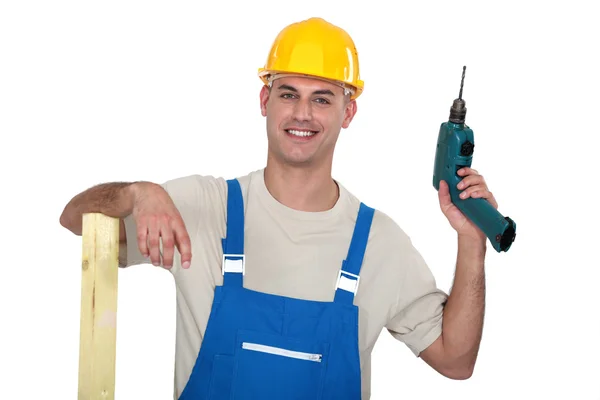 A male carpenter with a drill. — Stock Photo, Image