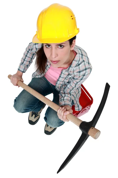 Woman with a pickaxe — Stock Photo, Image