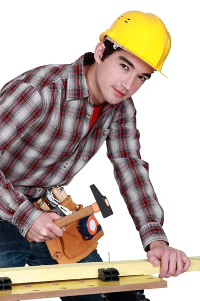 Man tapping in a nail — Stock Photo, Image