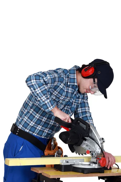 Joiner at work with workbench and machine — Stock Photo, Image