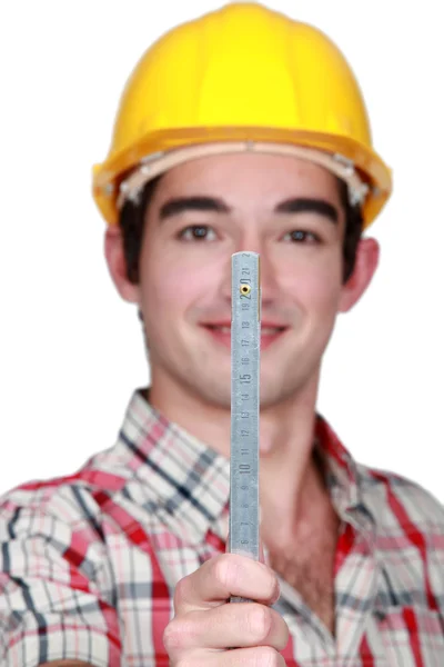 Portrait of craftsman holding ruler — Stock Photo, Image